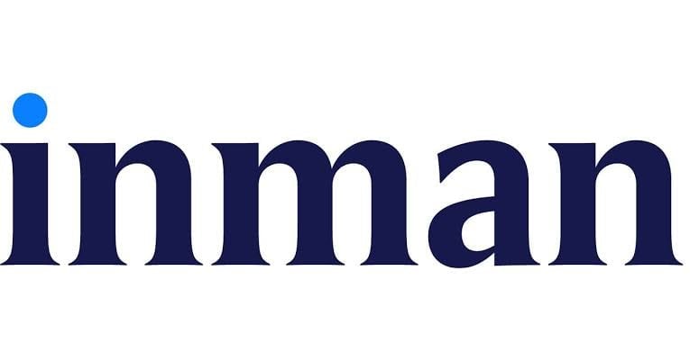 Inman logo featuring dark blue text with a blue dot accent above