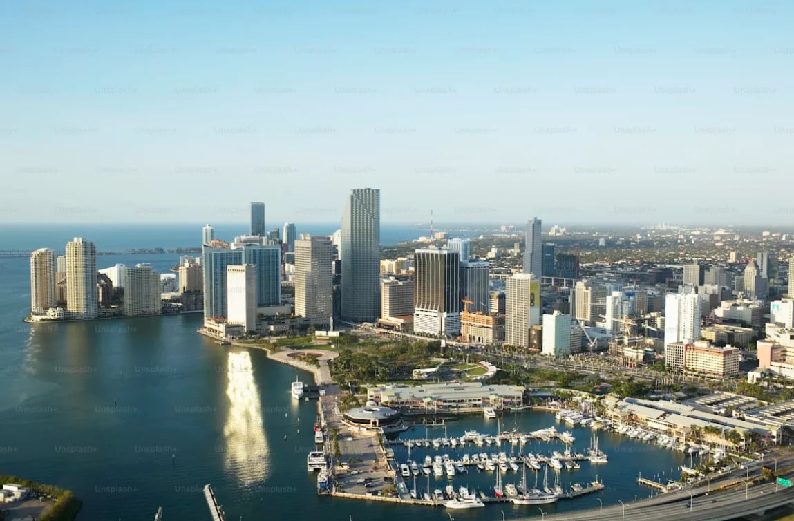 Aerial view of Chicago skyline with Lake Michigan, downtown buildings, and a marina filled with boats along the waterfront