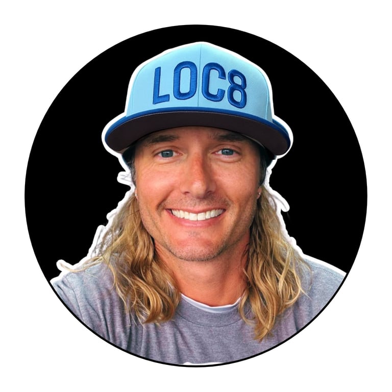 Bobby Kerr wearing a light blue LOC8 baseball cap, smiling, circular profile portrait on black background